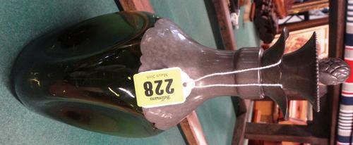 A 1930's Dutch dimpled green glass decanter with pewter collar and pewter mounted stopper, marked “Gero”, 25.5cms high