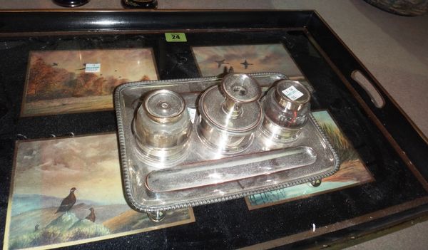 A silver plated three division inkstand, together with a black lacquer twin handled tray inset with four prints of birds. (2)