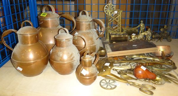 A quantity of 20th century copper and brass wares, including a graduated set of copper lidded jugs, assorted brass implements and sundry.