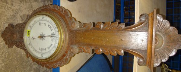 A 20th century oak wheel barometer.