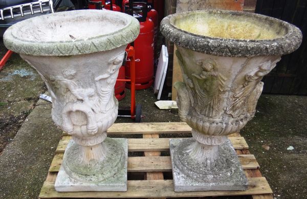A pair of large reconstituted stone garden urns in the Classical manner, relief decorated with dancing female figures, 81.5cms high (2)