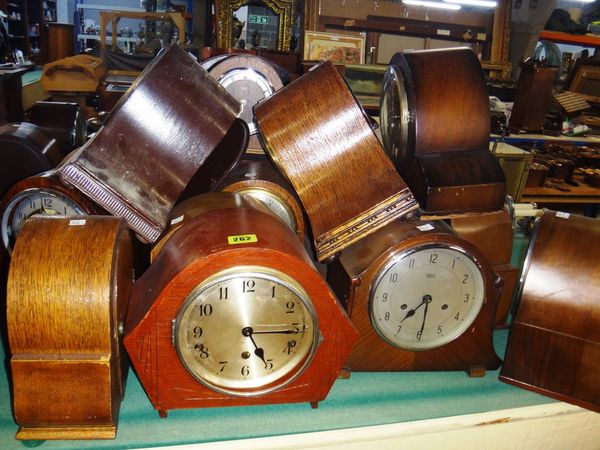 A group of fifteen assorted early 20th century mantel clocks.