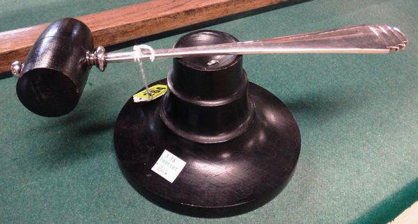 A white metal and ebonised wood gavel/ nutcracker and stand, the gavel with handle in the Georg Jensen Pyramid Pattern, the stand of circular stepped