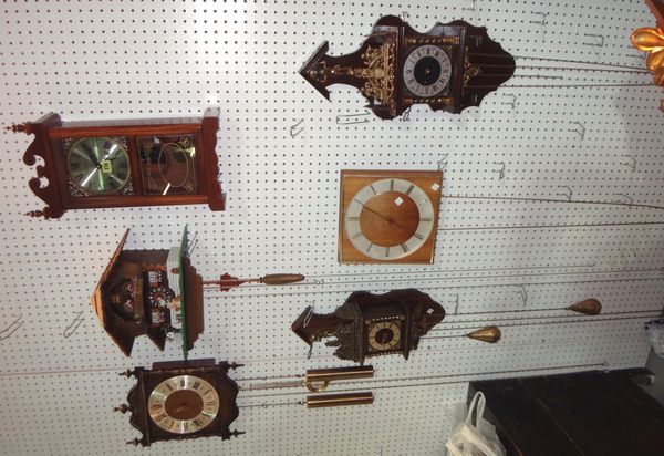 A group of six assorted 20th century clocks, cuckoo clocks, mantel clocks and wall clocks.