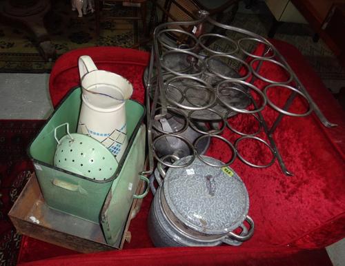 A quantity of kitchenalia including enameled metal pots, a kettle, a bottle rack and sundry.