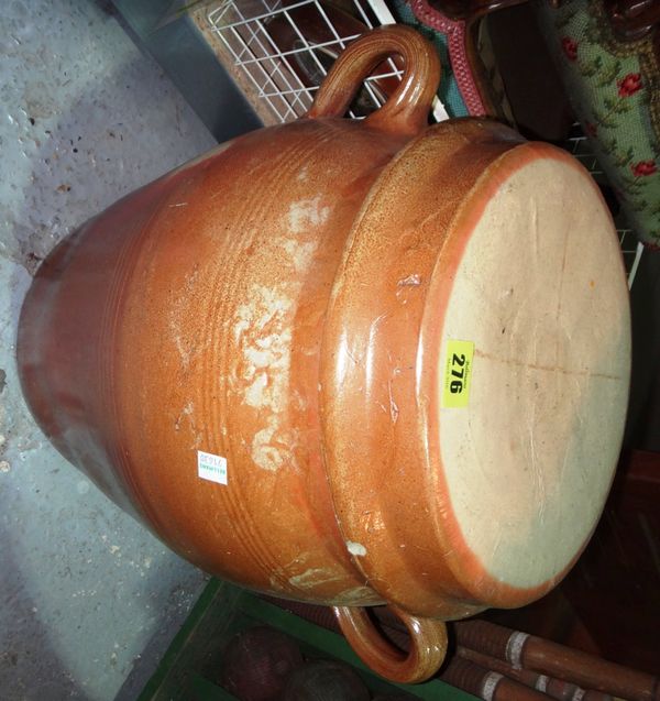 A large stoneware twin handled pot and cover.
