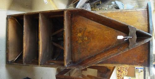 An open bookcase built from the end section of mid-War clinker built rowing boat by T Tims Long Bridges Oxford, four open shelves with prow base, 137.