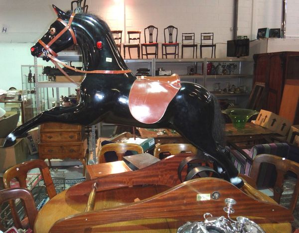 A 20th century model of a rearing horse on a sprung rocking base.