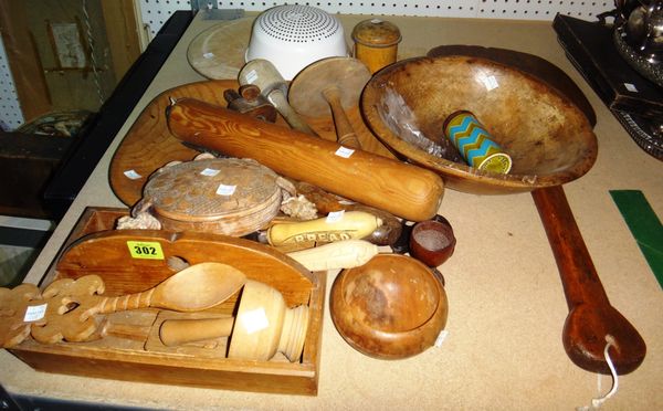 A quantity of mainly 20th century wooden items, including kitchenalia and treen bread boards, bowls, rolling pins and sundry.