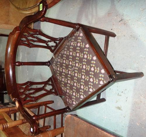 A George III mahogany double splat back corner chair, on canted square supports.