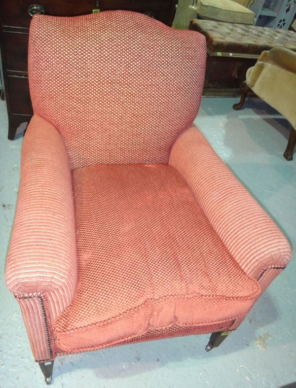 A mahogany framed armchair with red upholstery.