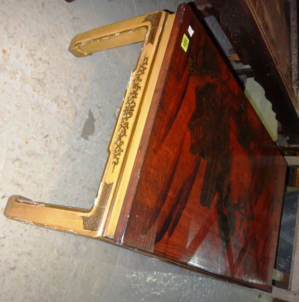An Oriental red and gilt rectangular coffee table.