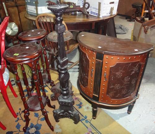 A pair of 20th century hardwood jardiniere stands, together with two hardstone candle stands and a demi-line side cabinet.
