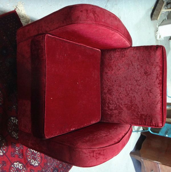 A French style red velvet upholstered armchair.