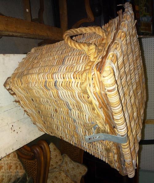 A concave wicker basket, a three tier wire work cake stand and a metal standard lamp. (3)