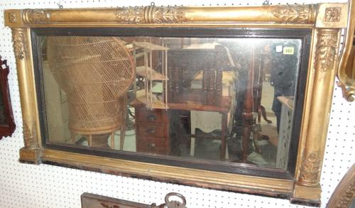 A 19th century gilt and ebonised overmantel mirror.