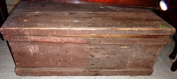 A 19th century pine trunk containing tools.