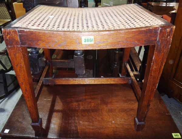 A 20th century oak and cane stool.
