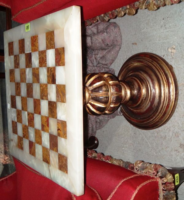 A gilt and onyx chess table.