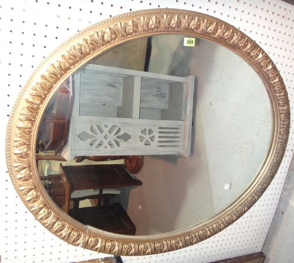 An oval gilt wall mirror and another. (2)