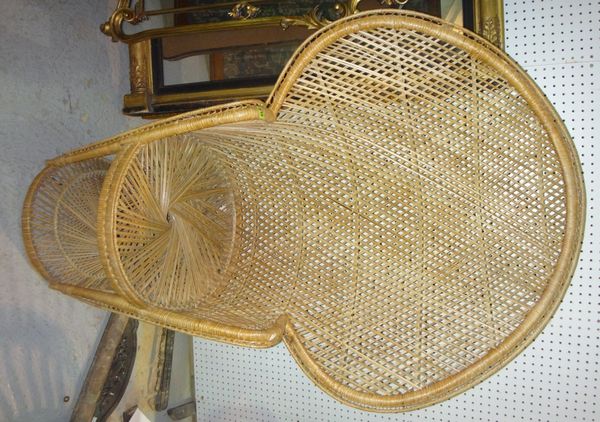 A wicker peacock armchair.