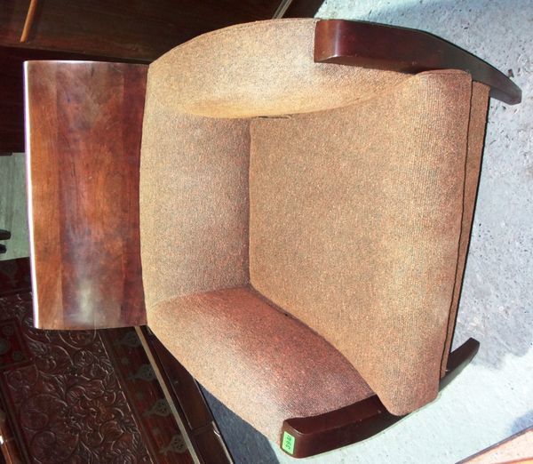 A 20th century walnut and brown upholstered low armchair
