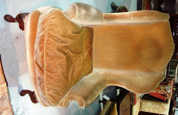 A 19th century mahogany framed wing armchair.