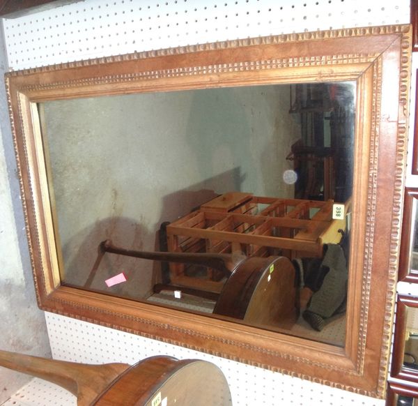 A mahogany and maple rectangular wall mirror.