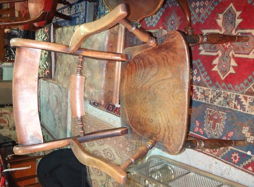 A 19th century elm and ash kitchen scullery armchair.