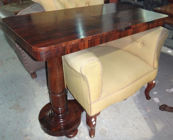 A 19th century rosewood reading table.