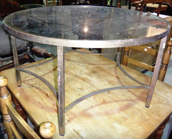 A circular brass and glass coffee table.