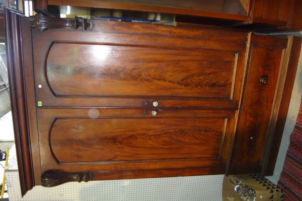 A 20th century mahogany wardrobe.