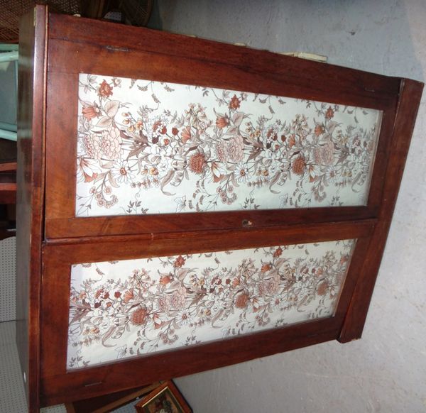 A mahogany two door glazed cabinet.