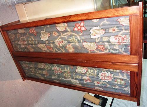 A pitch pine two door glazed cabinet and another similar two door wall cupboard. (2)