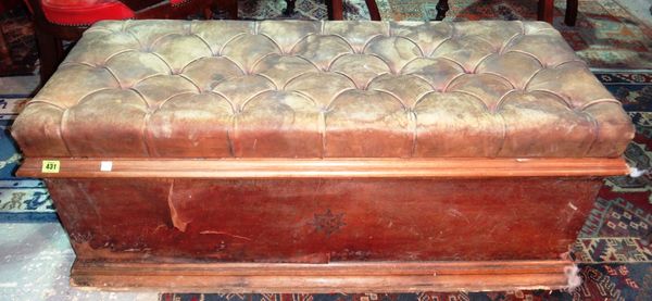 A leather upholstered box Ottoman.