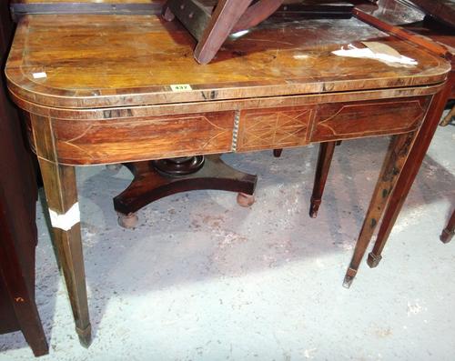 A George III rosewood card table.