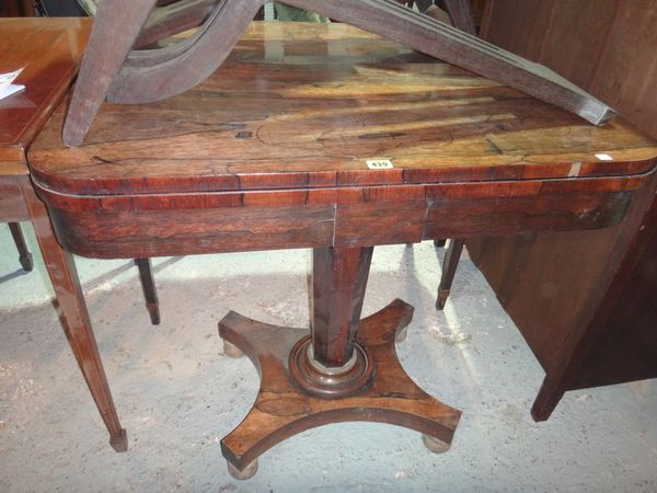 A 19th century rosewood foldover card table.