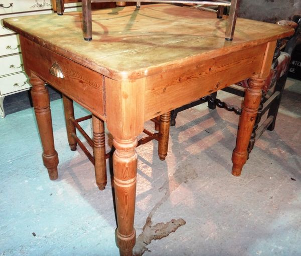 A 19th century pine rectangular kitchen table with two drawers.