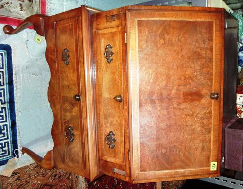 A 20th century burr walnut bureau in the early 18th century style.