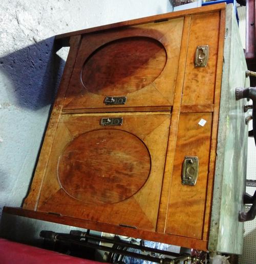 A 20th century walnut side cabinet, with pair of drawers and cupboards and a green marble top.
