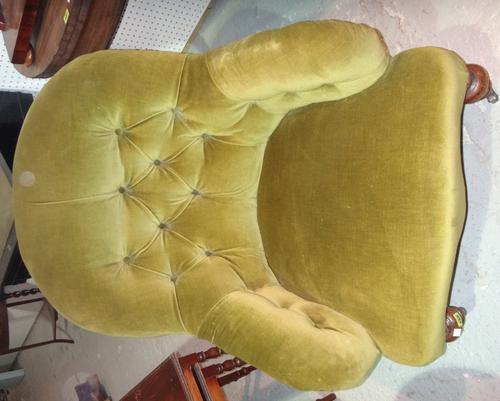 A 19th century framed button back nursing chair.