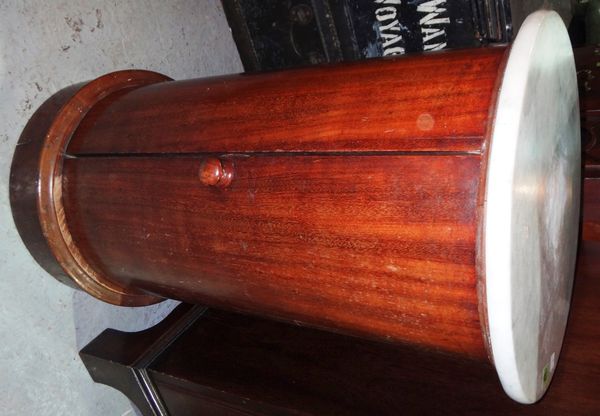 A 19th century mahogany and marble top circular pot cupboard.