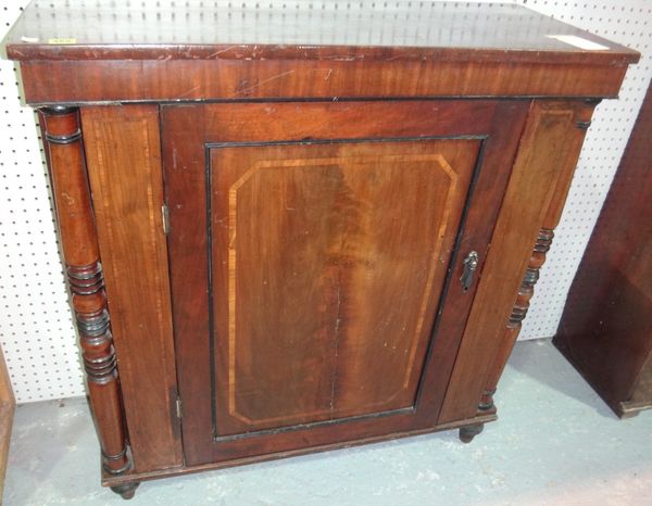 A 19th century mahogany side cupboard with panelled door.