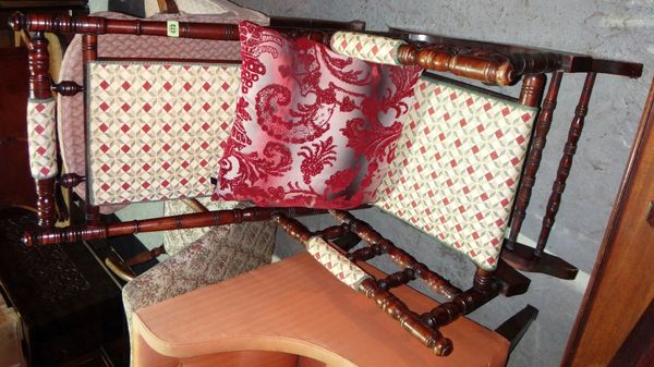 A walnut framed American style rocking chair.
