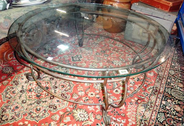 A 20th century metal and glass circular coffee table.