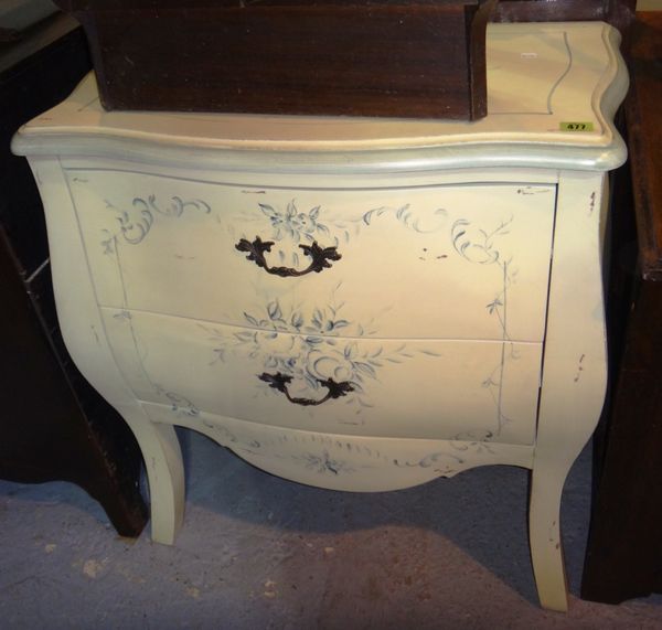 A 20th century painted two drawer bombe shaped commode.