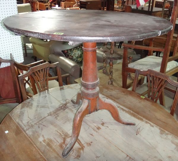 A 19th century oak tilt top tripod table.