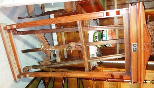 A 19th century wall mounted cue stand and an oak wall mounted coat rack. (2)