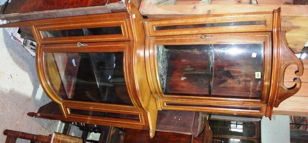 An Edwardian mahogany and satinwood banded double corner display cabinet in two parts.
