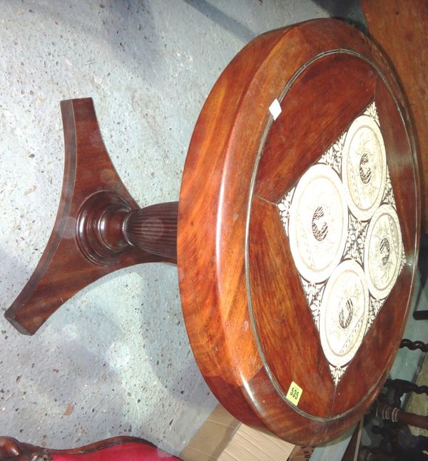 A 19th century mahogany circular occasional table with inset tile top.